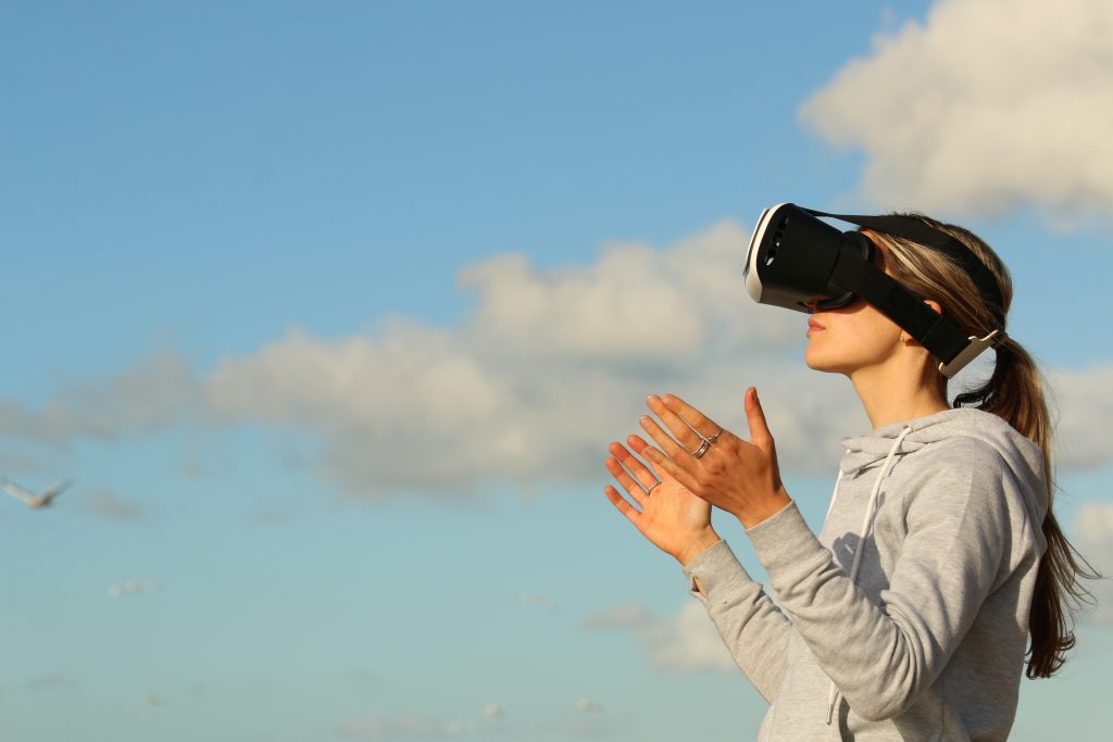 a picture of a woman wearing a virtual reality headset